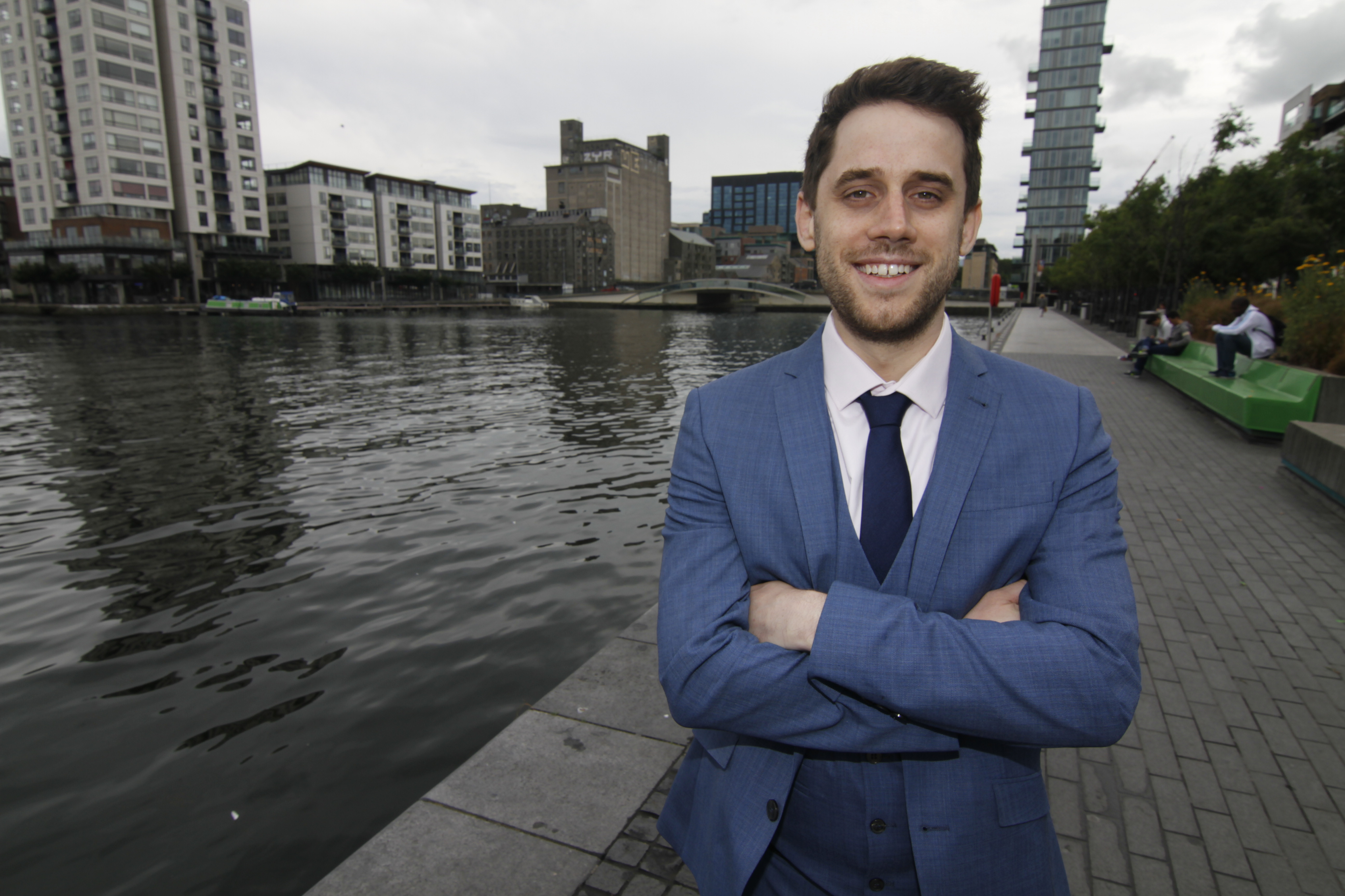 Louis standing awkwardly and dying inside.